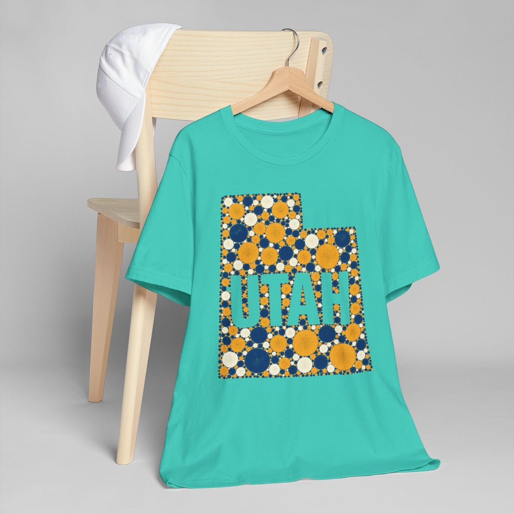 Teal T-shirt with blue and gold polka-dot Utah map outline and lettering graphic