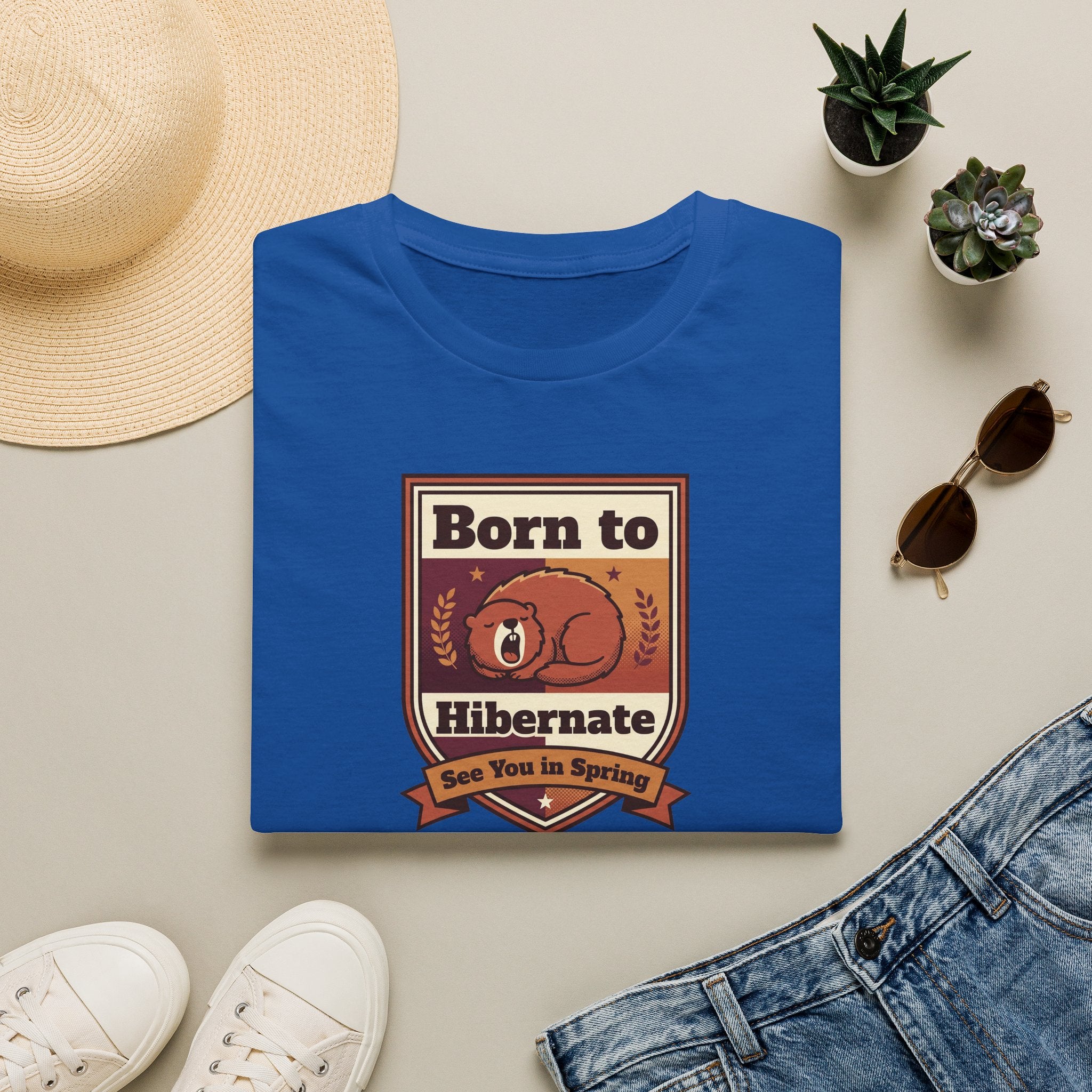 Royal blue graphic T-shirt with centered bear "Born to Hibernate" badge print