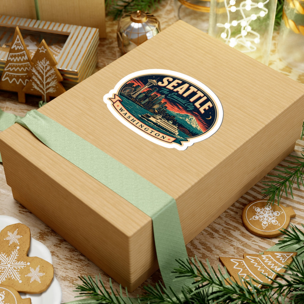 Seattle luggage tag sticker on a wrapped gift box, circular badge with Space Needle and WA banner