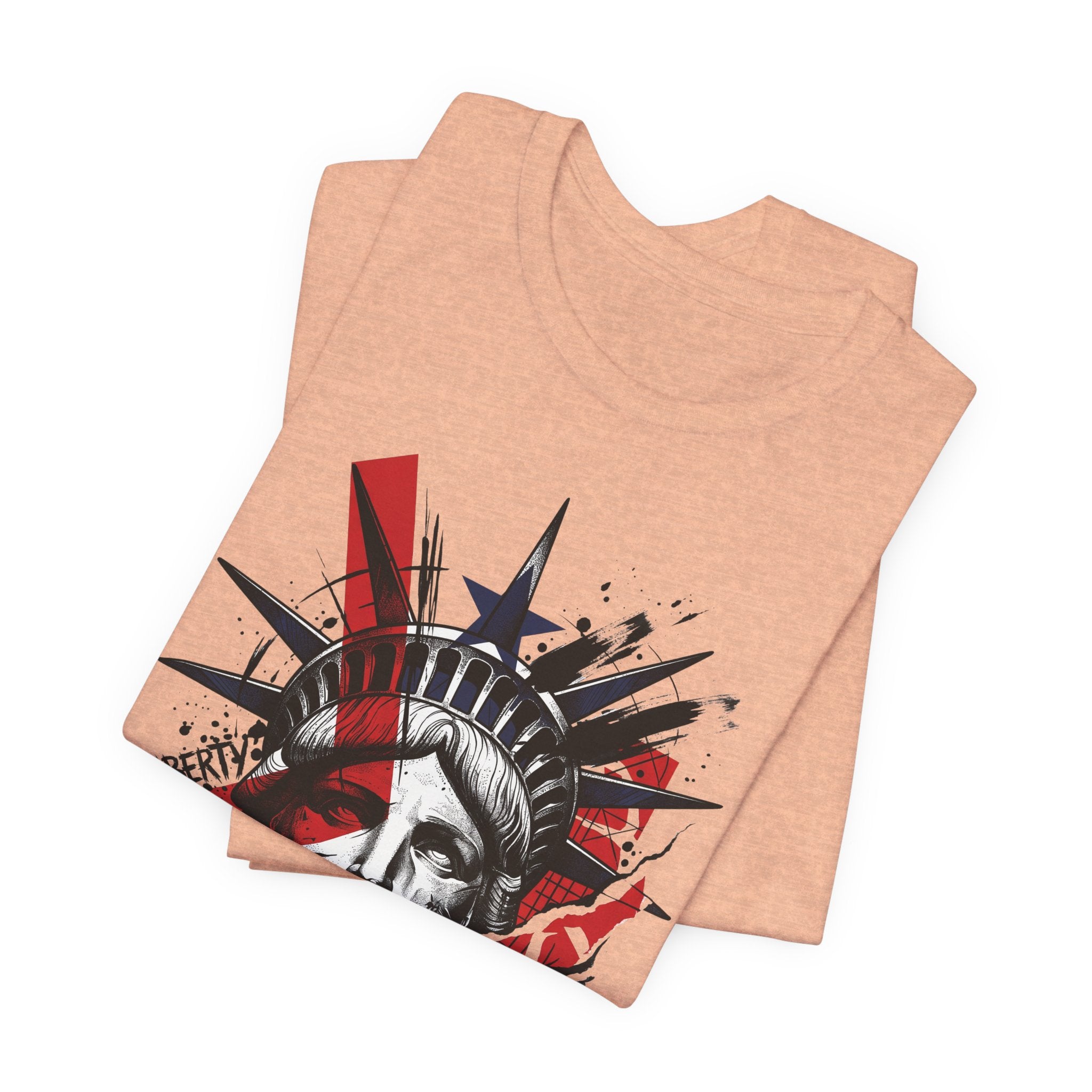 Peach graphic T-shirt showing Statue of Liberty face print in red and black