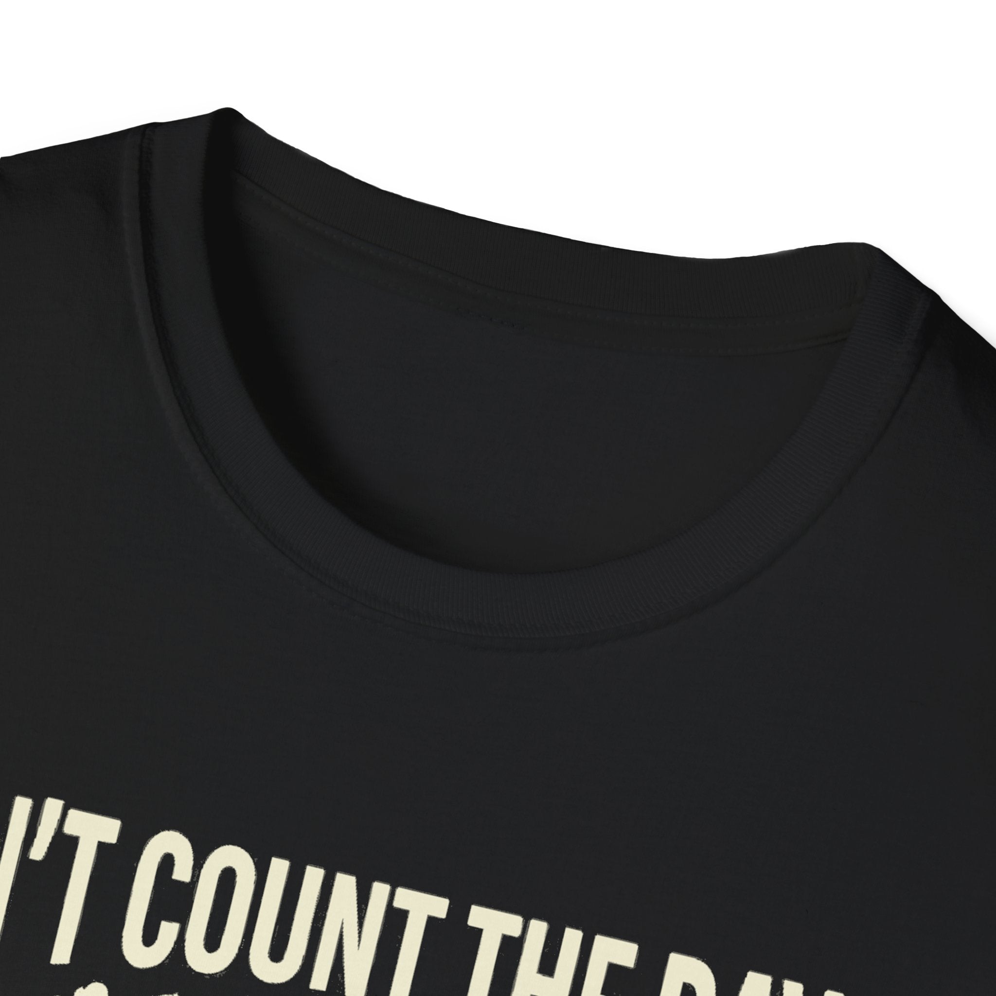 Black T-shirt neckline close-up; partial “DON'T COUNT THE” graphic print