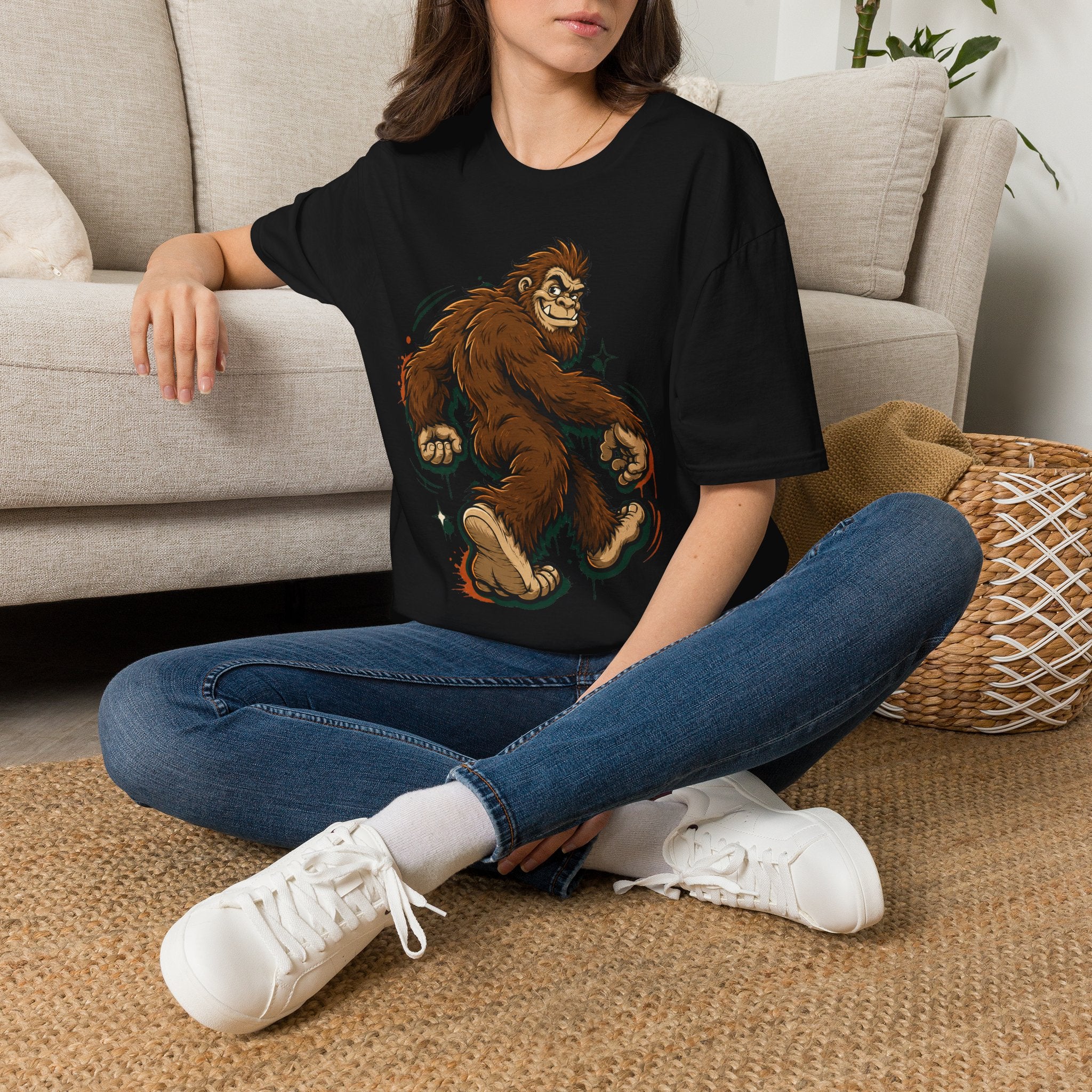 Black crewneck t-shirt with brown bigfoot cartoon graphic on the front