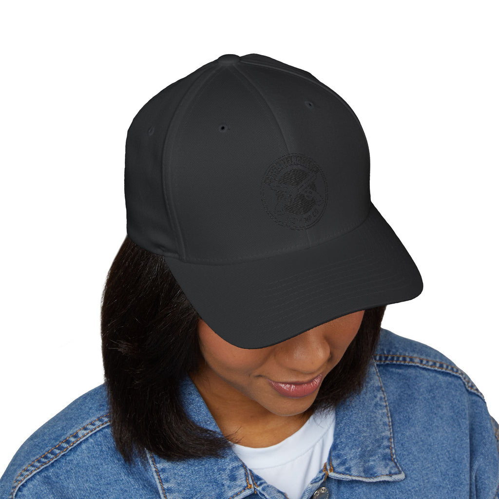 Black embroidered baseball cap with round black emblem on front