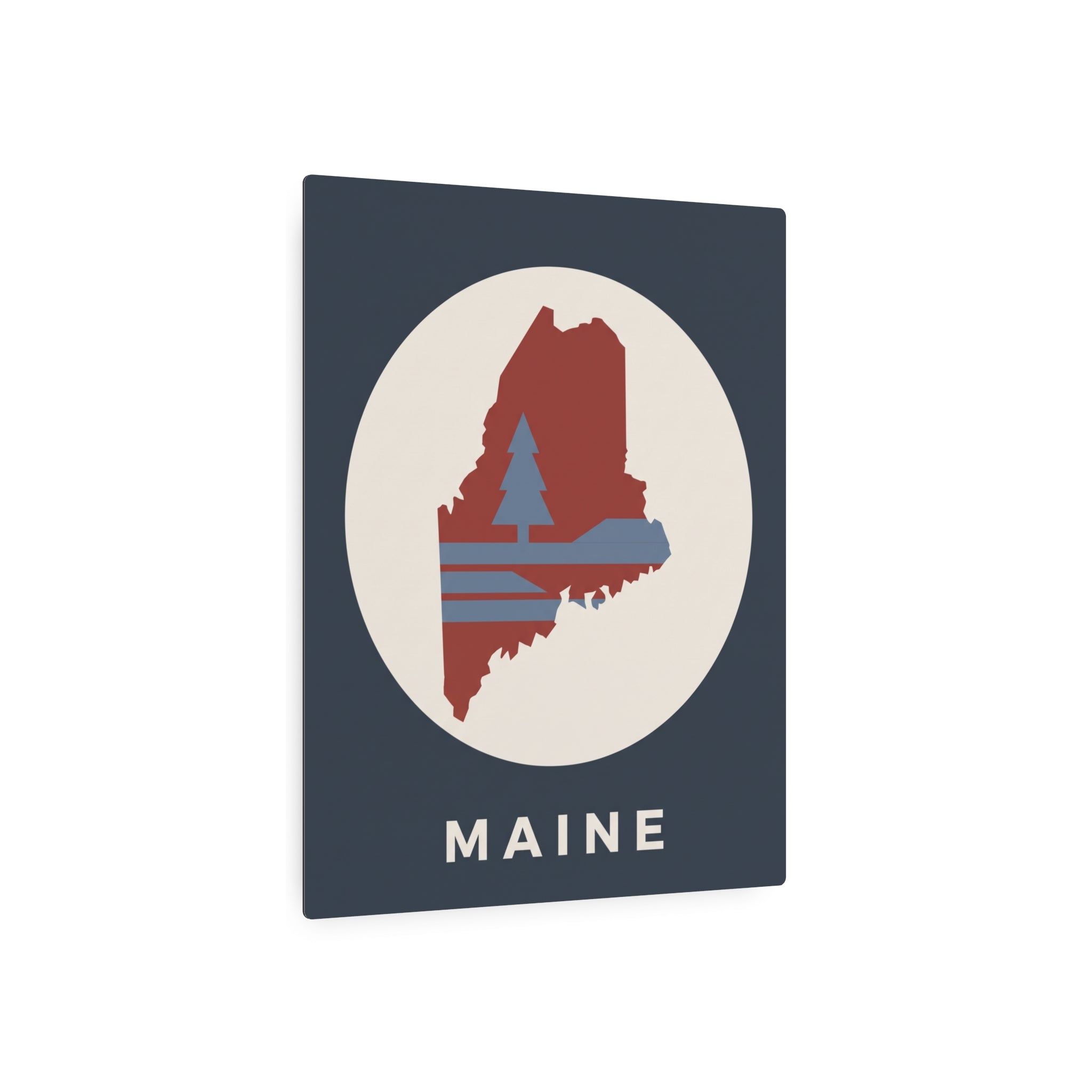 Maine state silhouette metal art sign with circular pine tree graphic and “MAINE” text