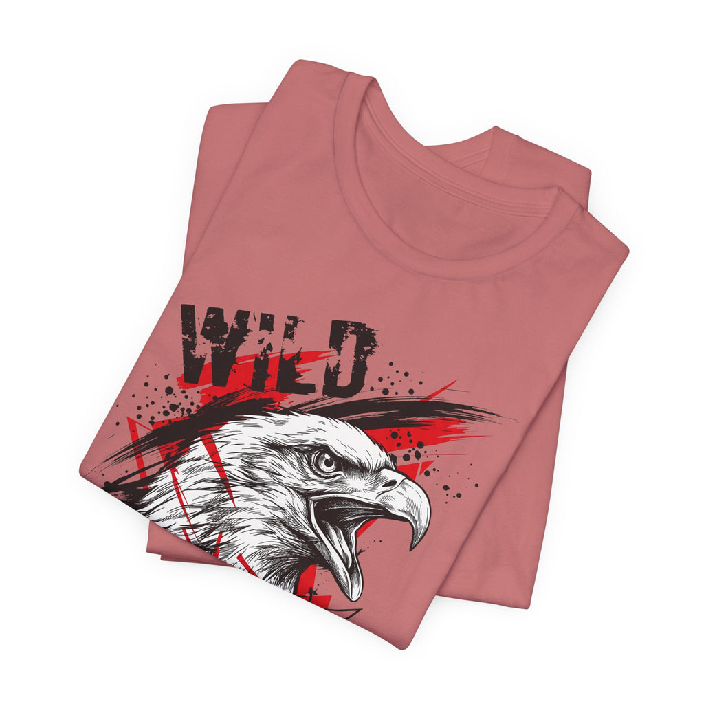 Dusty rose T-shirt with front eagle head graphic and patriotic splatter text.