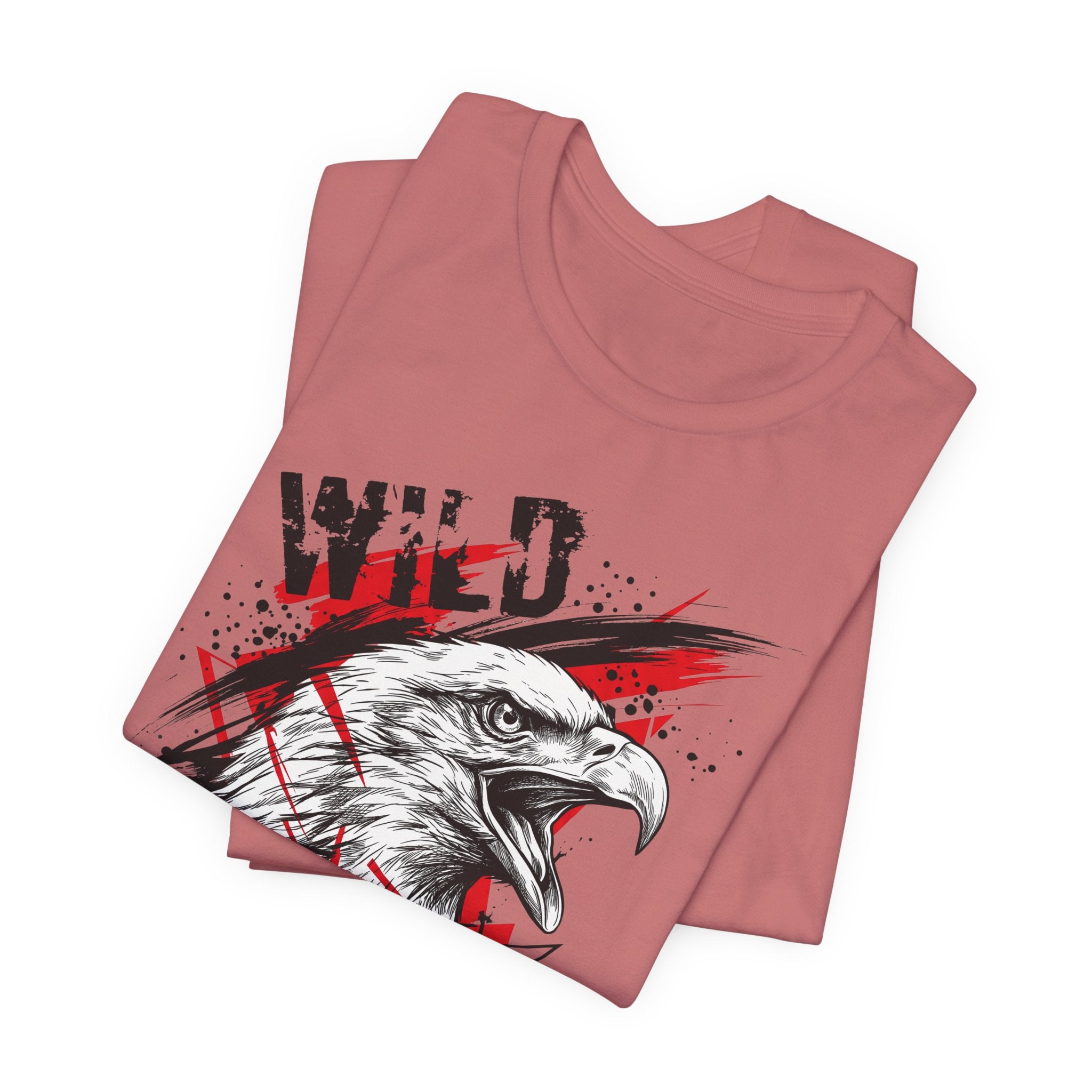 Dusty rose T-shirt with front eagle head graphic and patriotic splatter text.