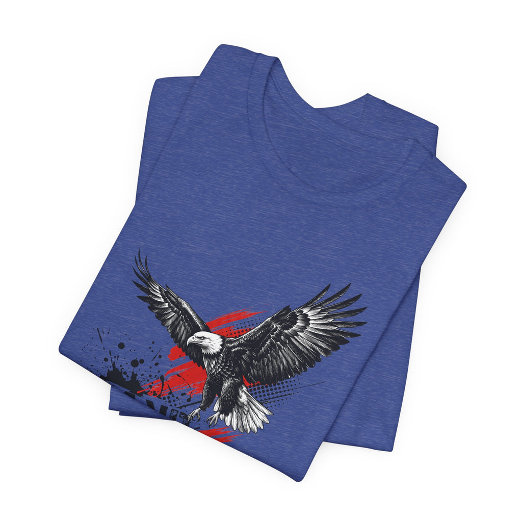 Royal blue graphic t-shirt with flying black eagle over distressed red-white-blue splash design.