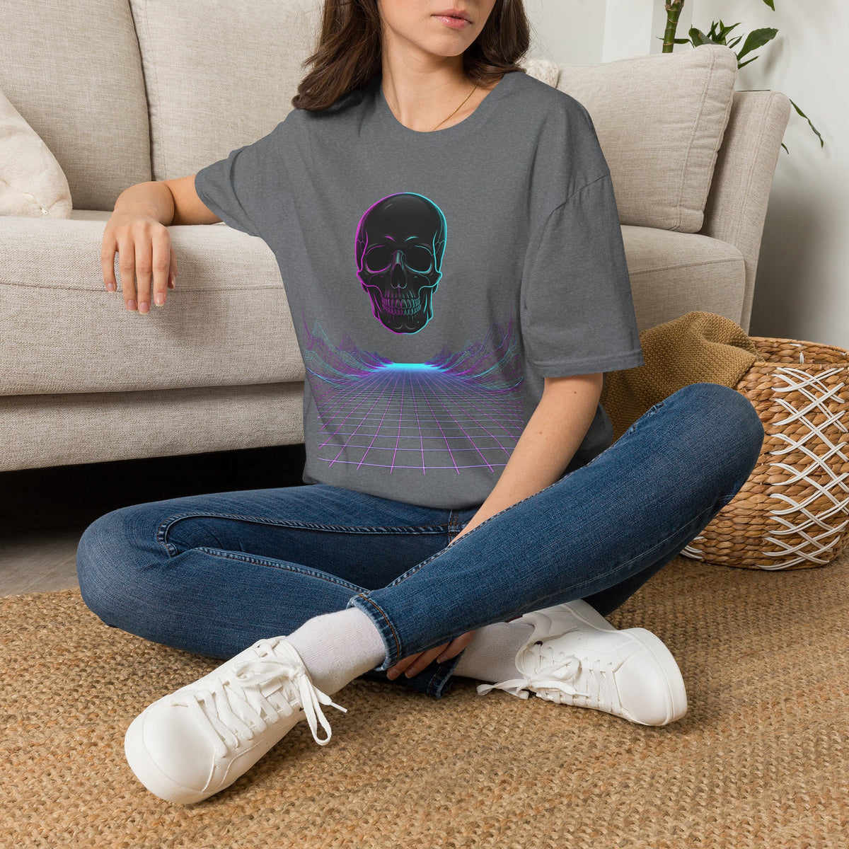 Unisex dark heather gray T-shirt with neon skull and cyber grid graphic, worn by model
