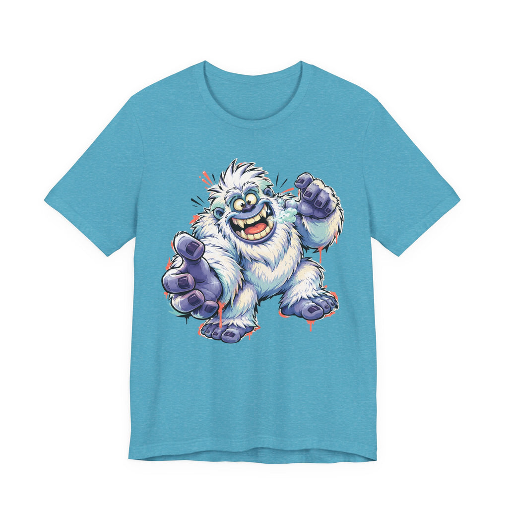 Teal monster t-shirt with cartoon yeti creature graphic waving and grinning
