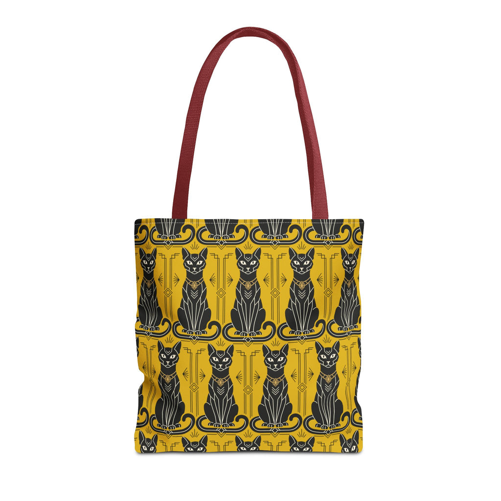 Tote bag with repeating cat silhouettes on yellow with blue accents, burgundy handles.