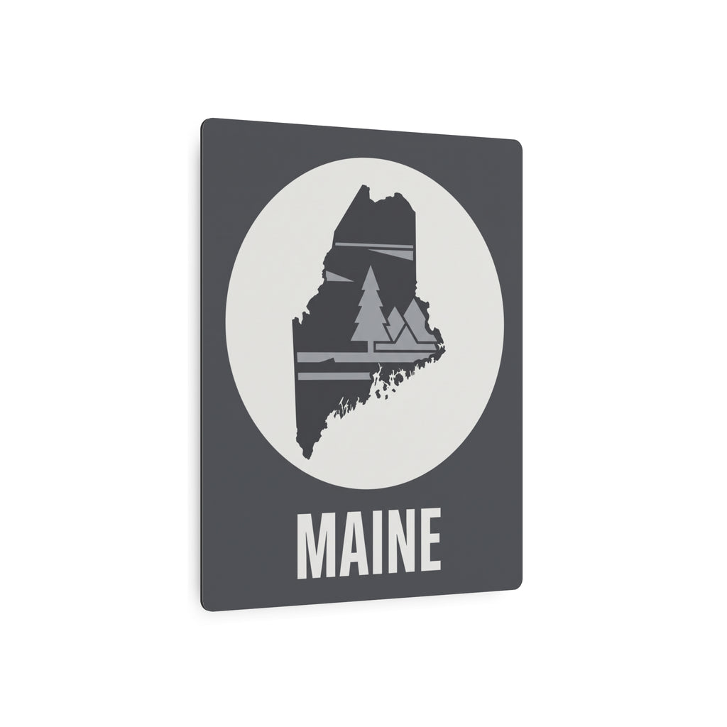 Maine metal art sign: dark gray panel with white circle, pine tree silhouette, MAINE word