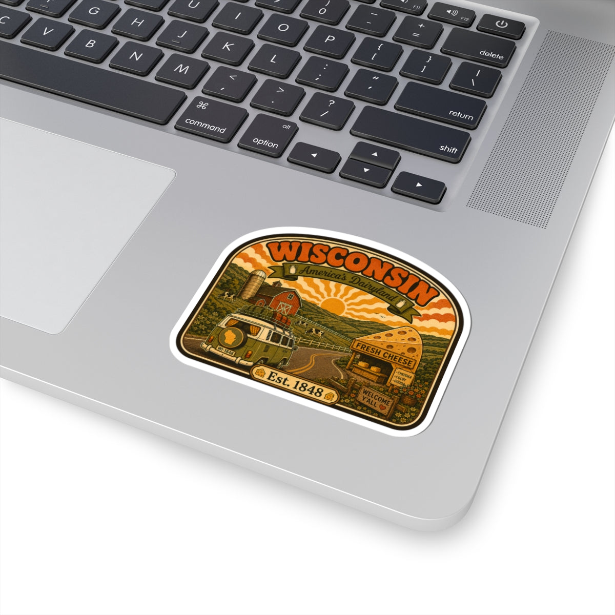 Wisconsin road trip sticker with farm landscape, cheese icon, welcome sign, Est. 1848