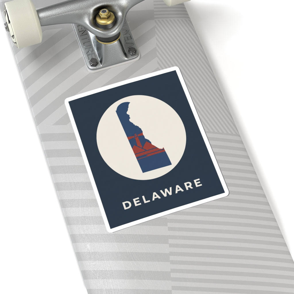 Kiss-cut Delaware sticker on a luggage tag, blue/red state silhouette in a white circle