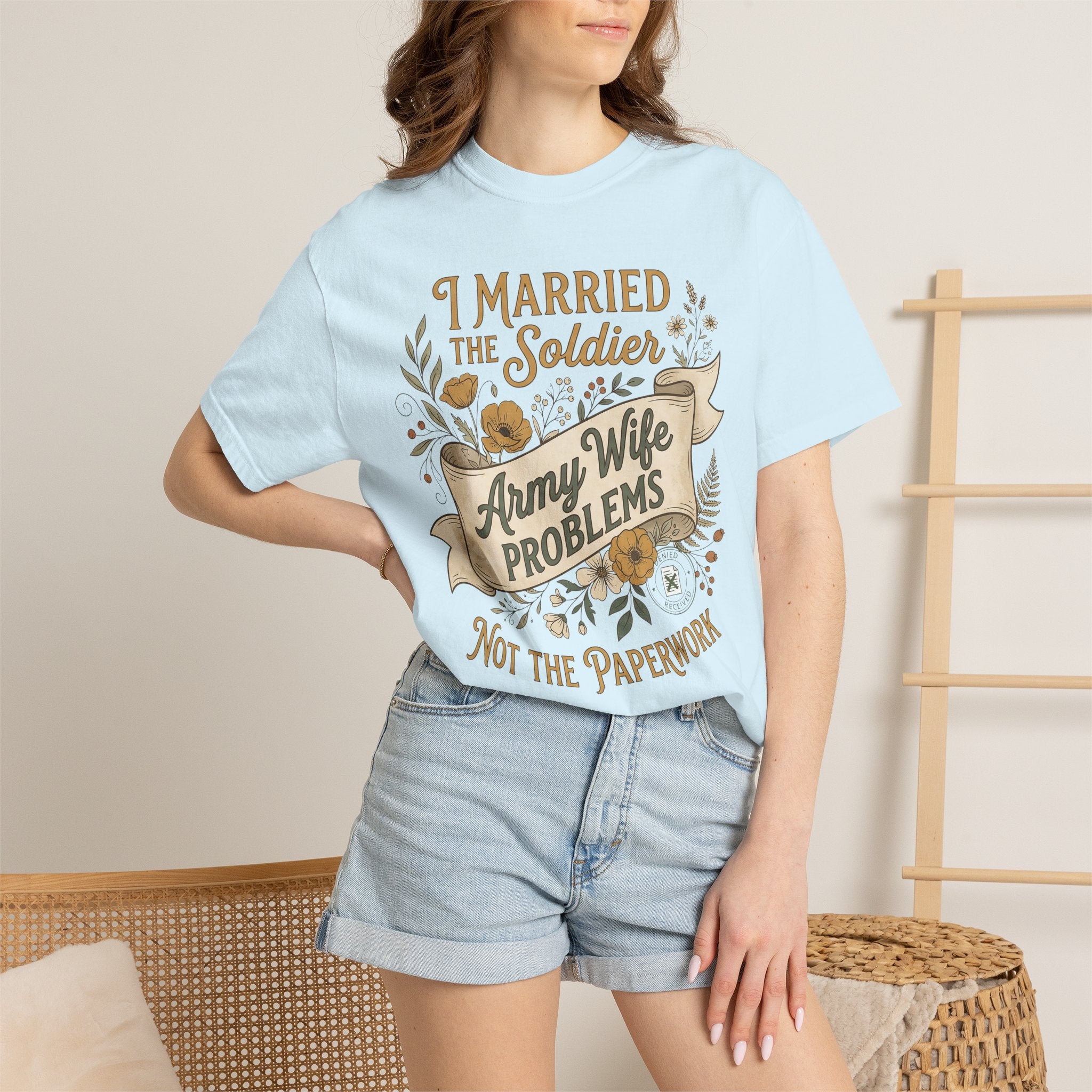 Light blue crewneck T-shirt worn by woman, 'Army Wife Problems' text