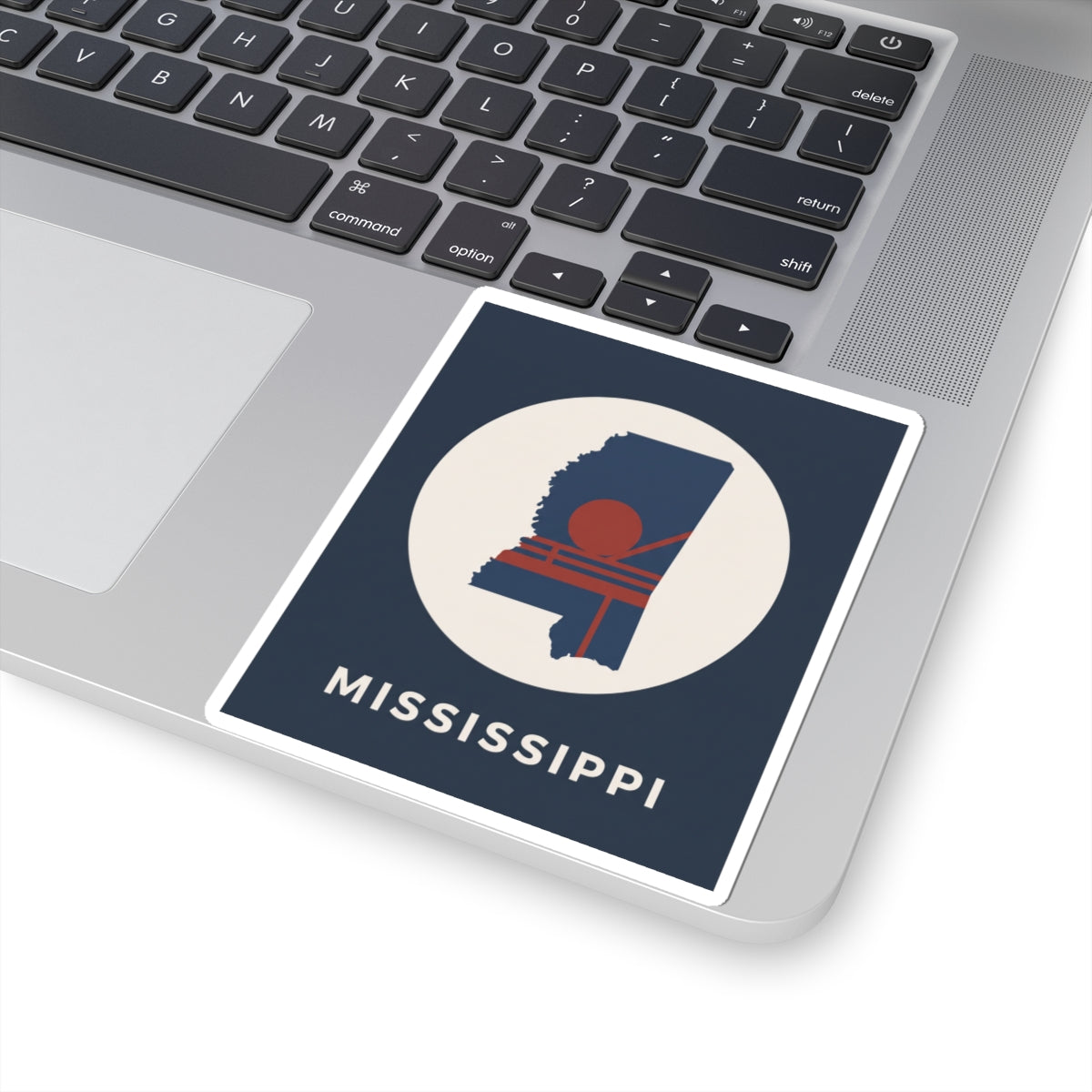 Square navy sticker with white circle, Mississippi graphic, red sun detail, and MISSISSIPPI text