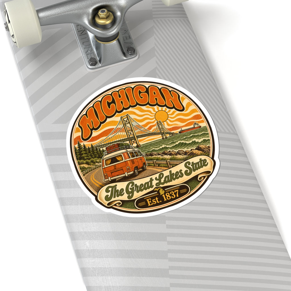 Michigan sticker with vintage orange camper, bridge, lake waves, “The Great Lakes State,” Est. 1837