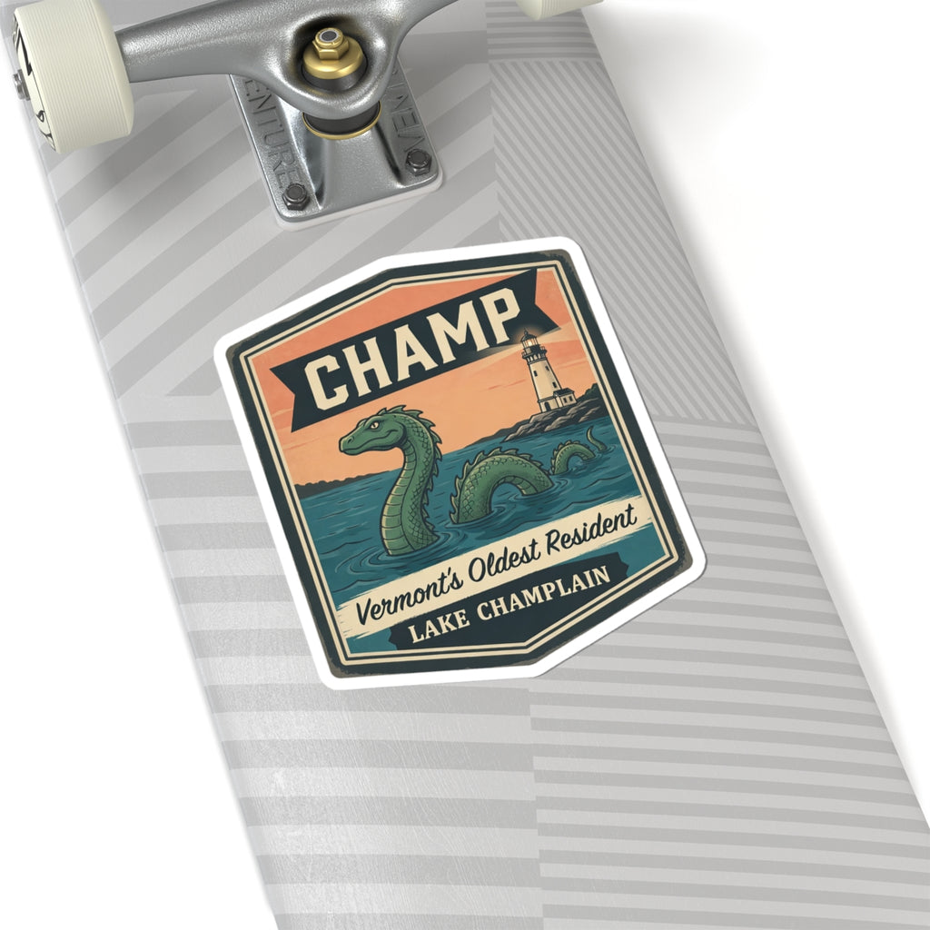 Sticker on a notebook page: CHAMP banner with green sea serpent and lighthouse illustration