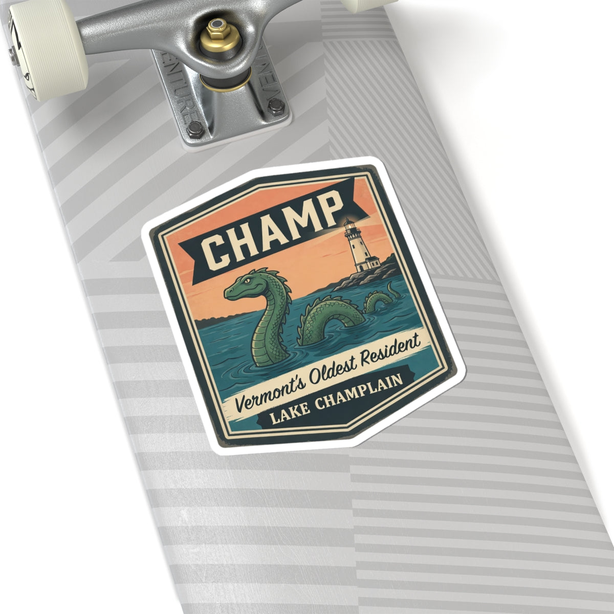 Sticker on a notebook page: CHAMP banner with green sea serpent and lighthouse illustration