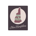 New Hampshire metal wall art sign with circular silhouette and “New Hampshire” text