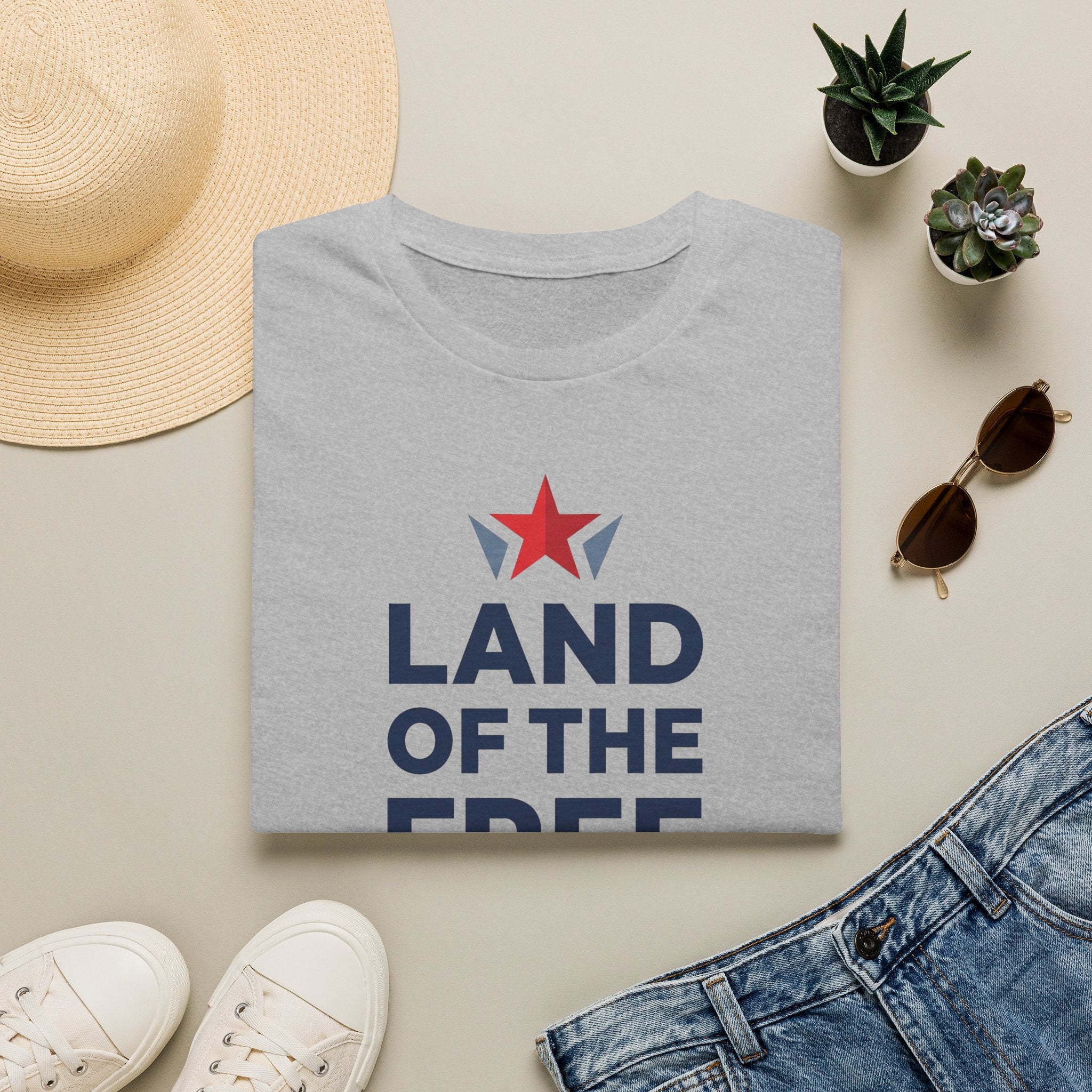 Light gray crewneck T-shirt with red star and blue "LAND OF THE FREE" front print
