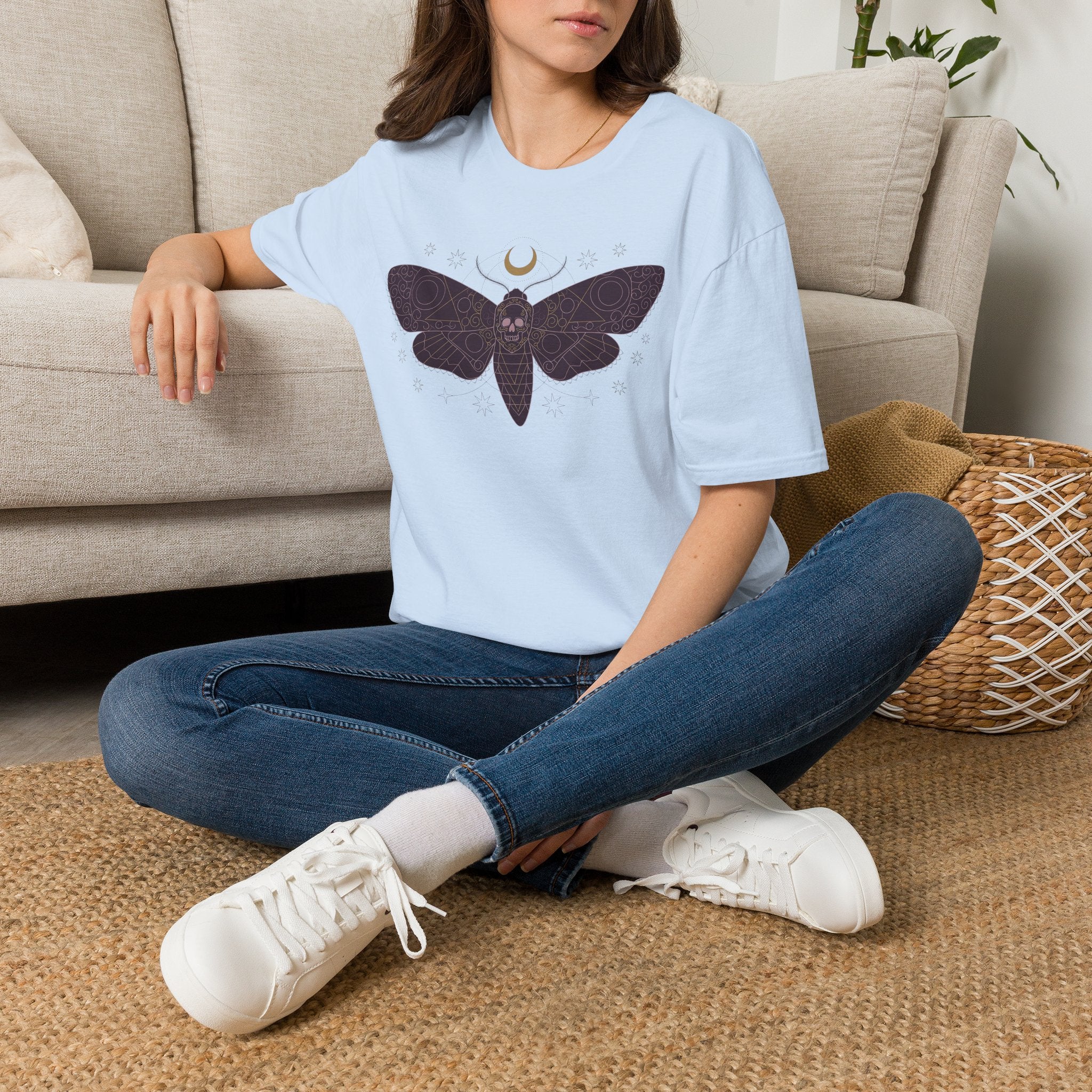 Light blue T-shirt with moth skull and crescent moon chest graphic