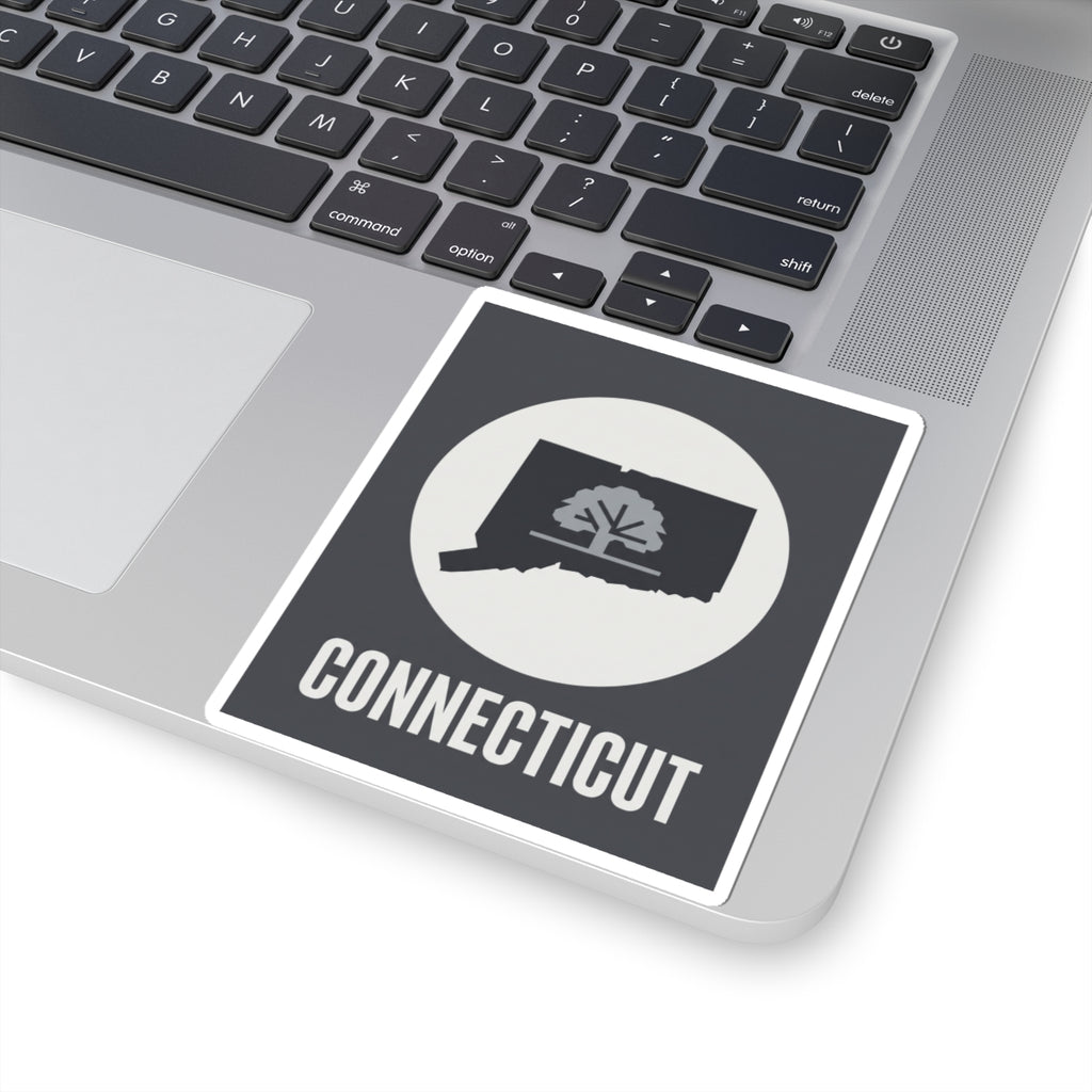Connecticut state tree silhouette sticker on a laptop, dark square with white circle