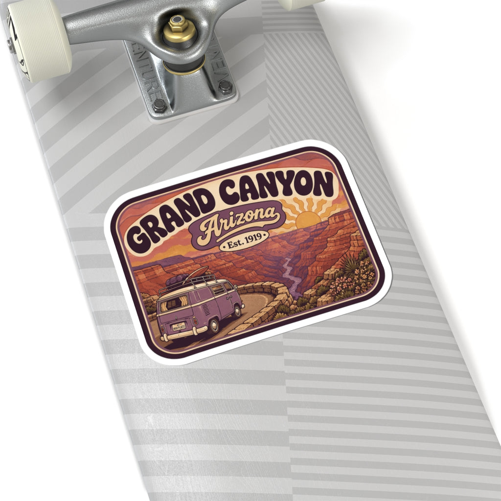 Rounded Grand Canyon sticker on gray notebook surface with purple camper van and canyon art