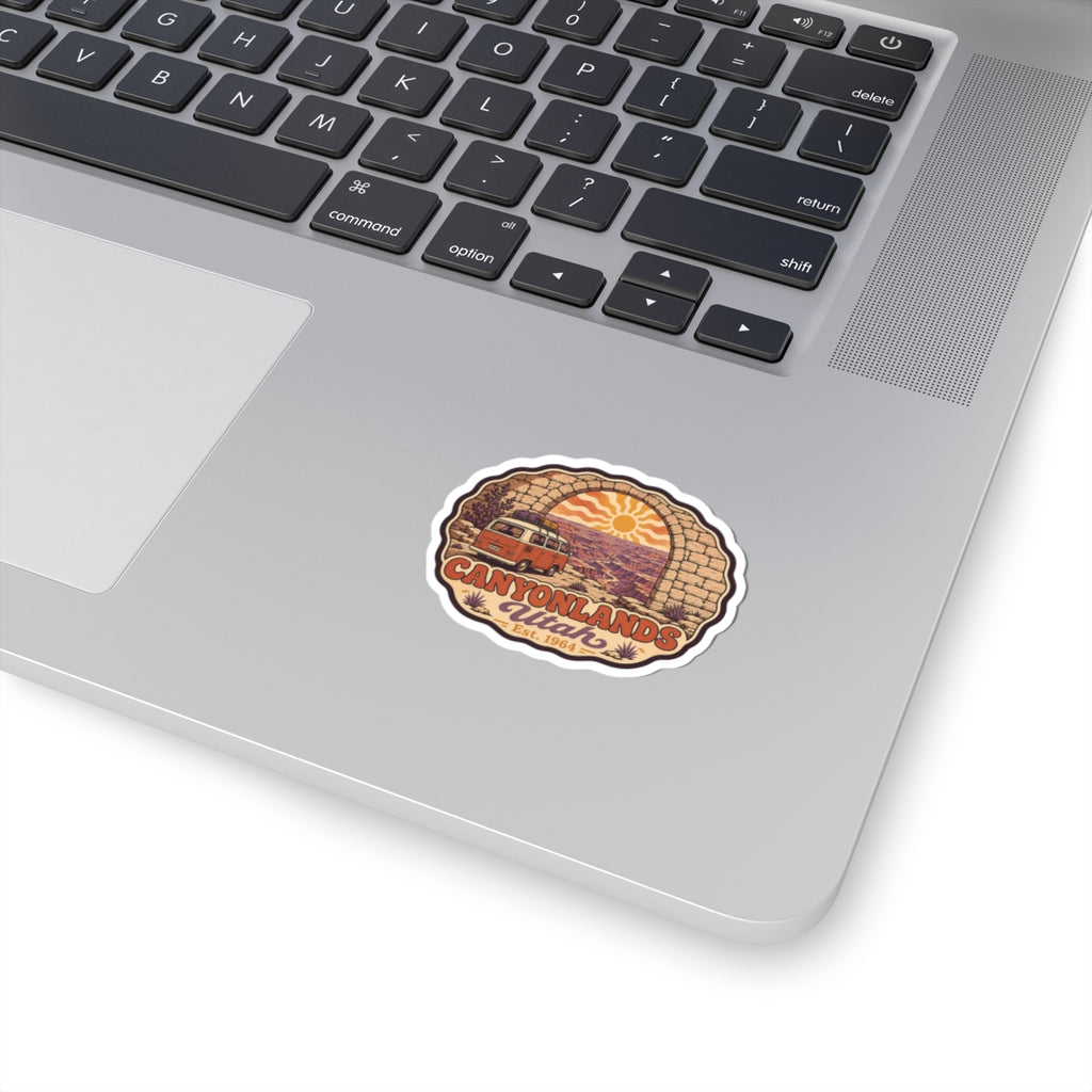 Canyonlands National Park sticker, round red rock logo decal on white surface