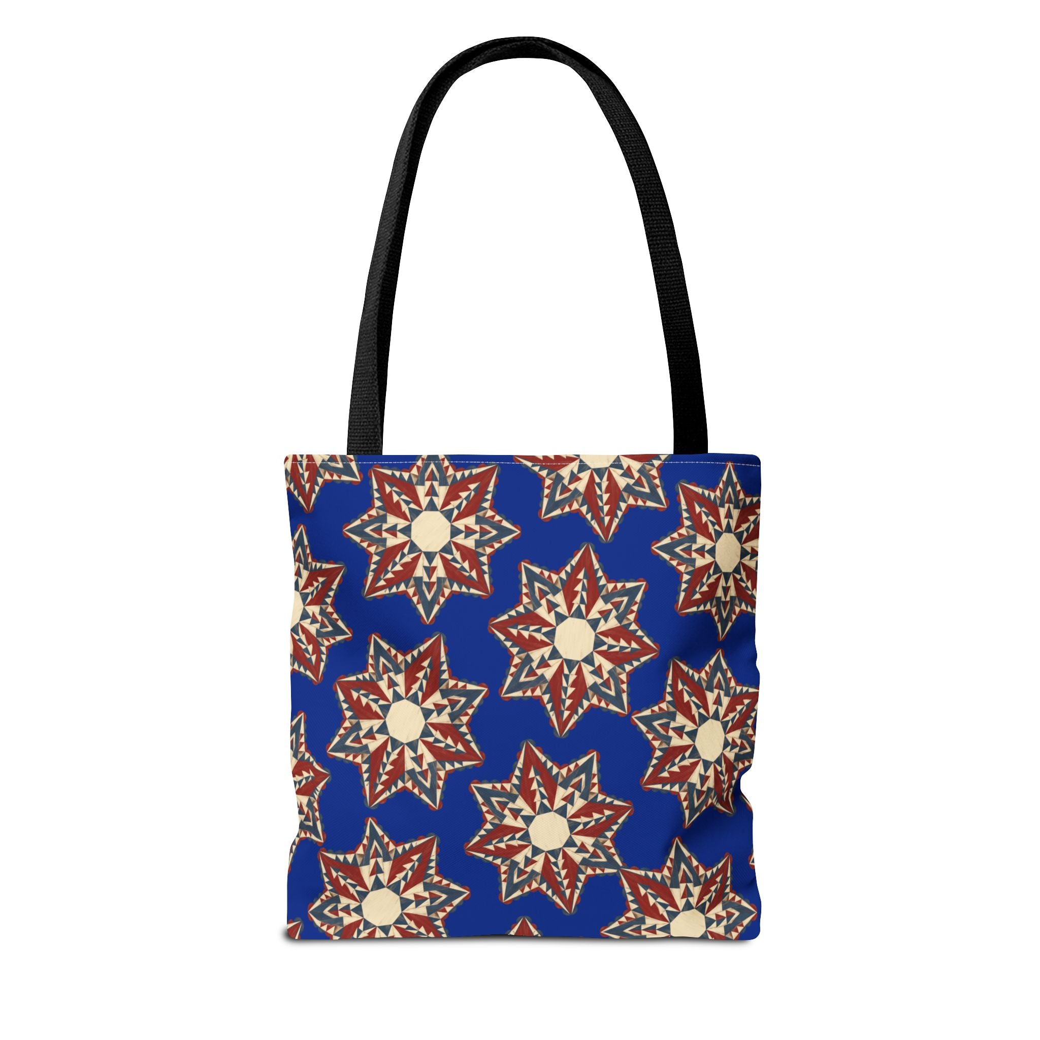 Blue tote bag with starburst floral mandala pattern and black handles