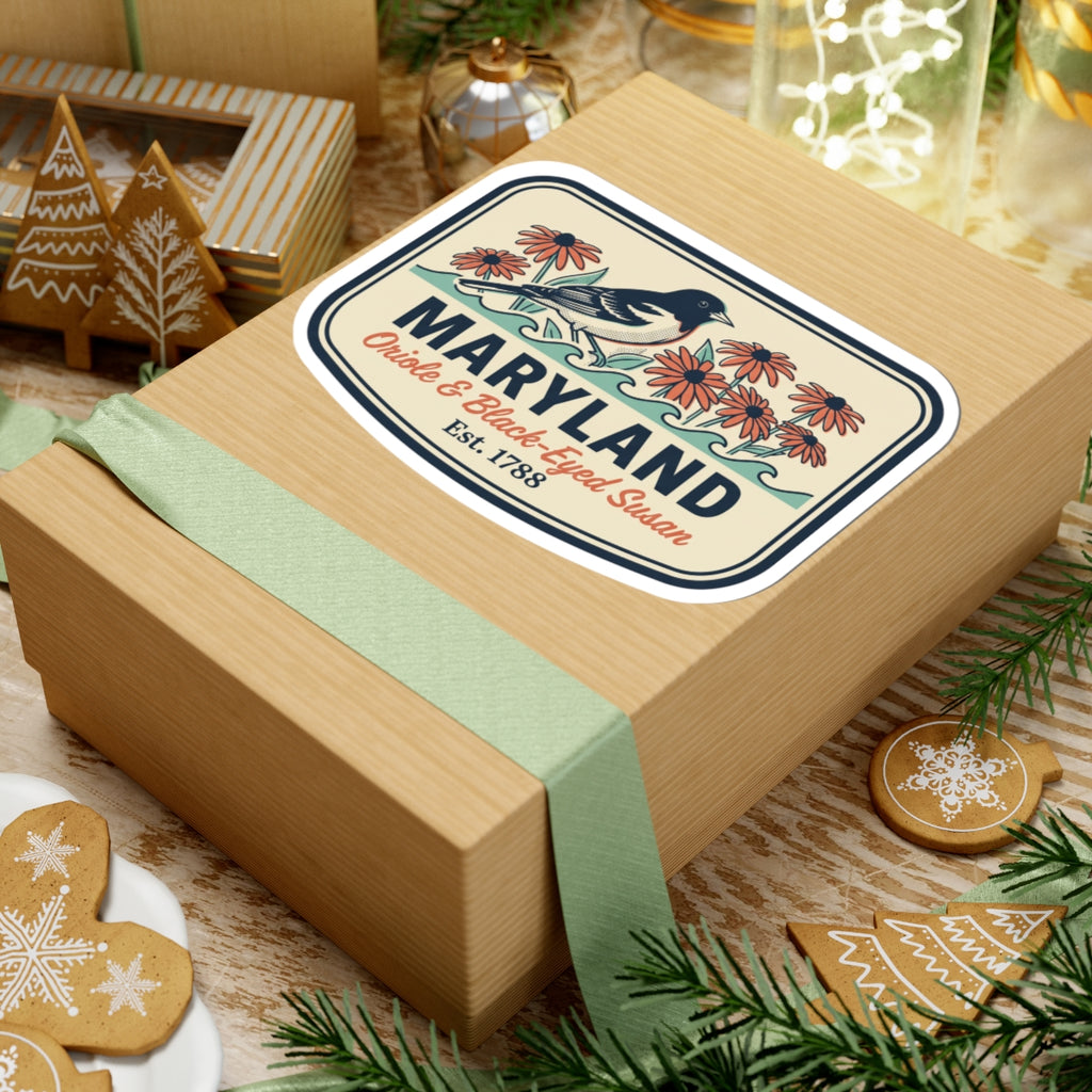 Maryland sticker on a gift box lid, bird-and-flower badge with “Maryland” and “Est. 1788”