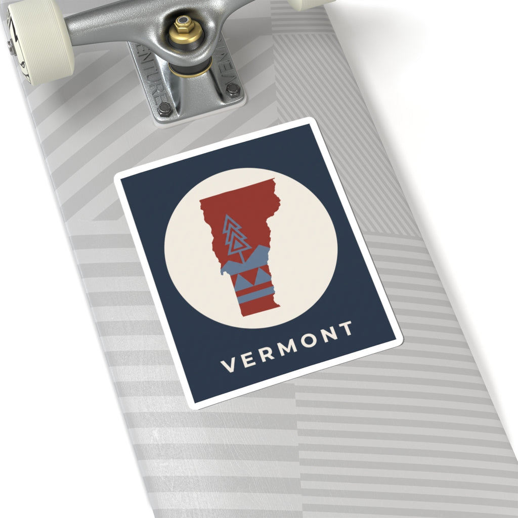 Vermont map kiss-cut sticker, navy rectangle with beige circle, red state graphic and blue mountains