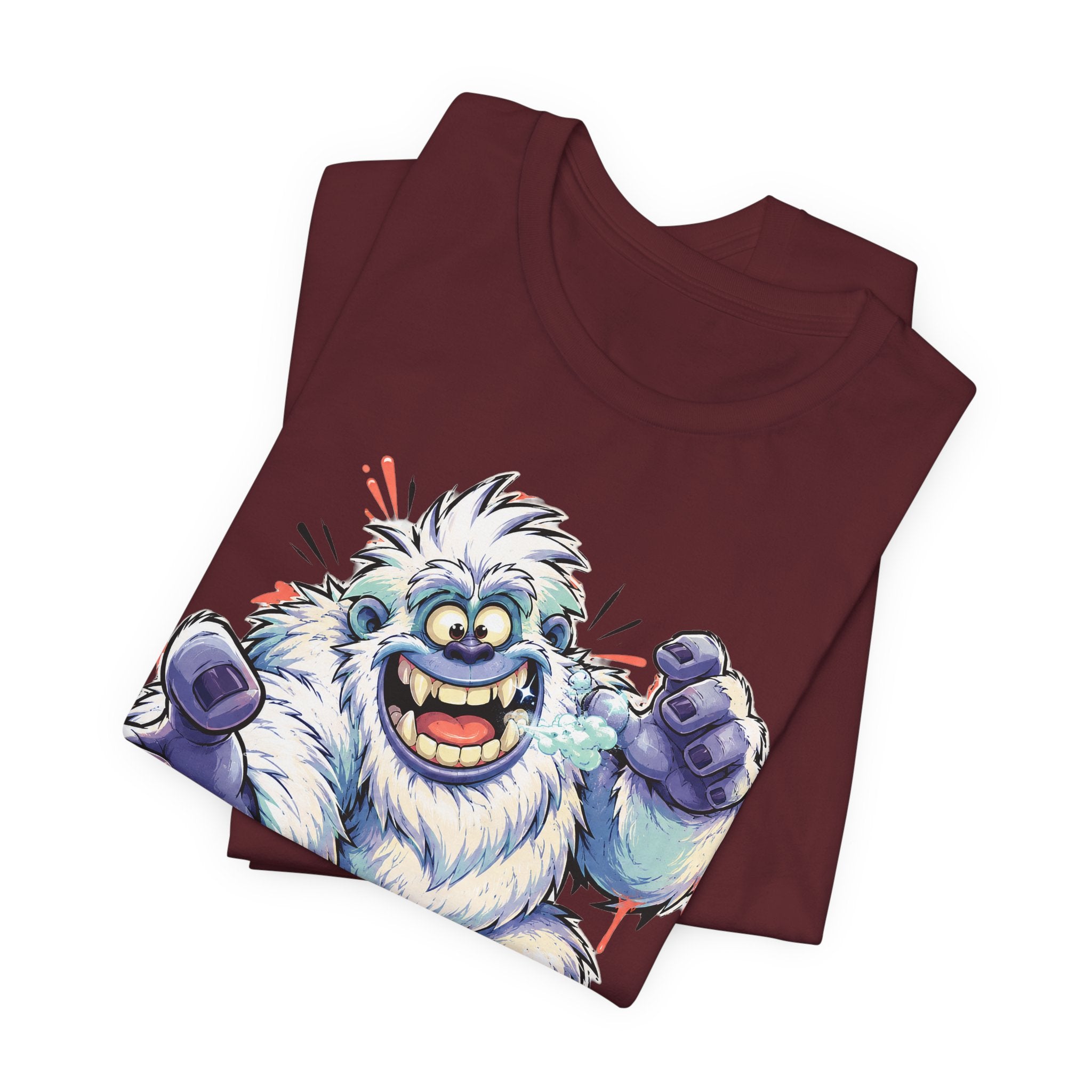 Burgundy T-shirt with cartoon snow monster graphic, blue fur and raised fists