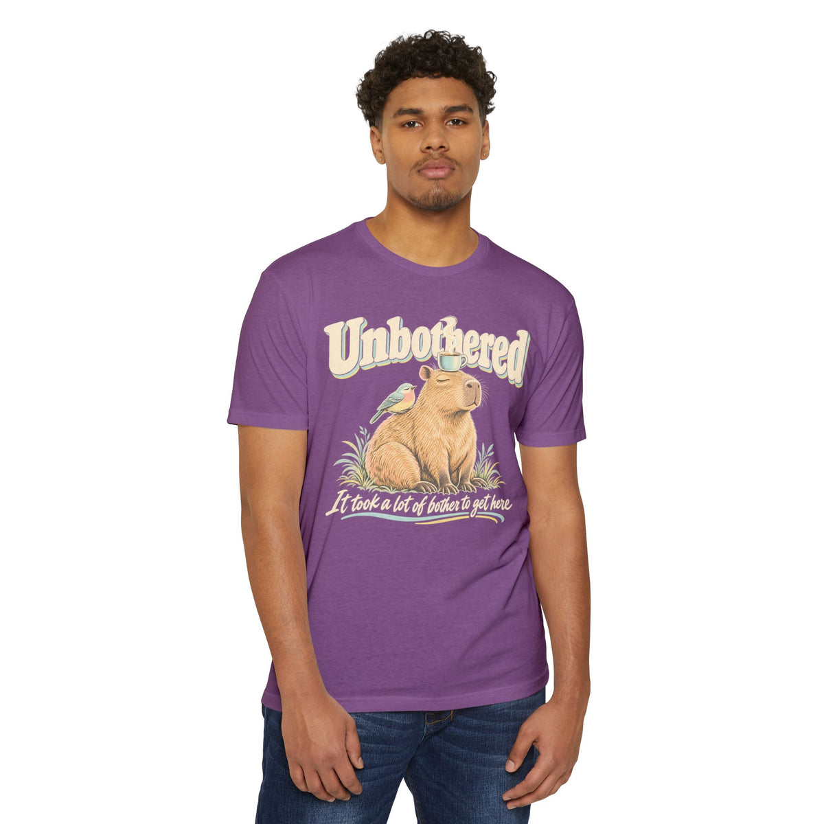 Purple crewneck graphic t-shirt with capybara and coffee-themed text