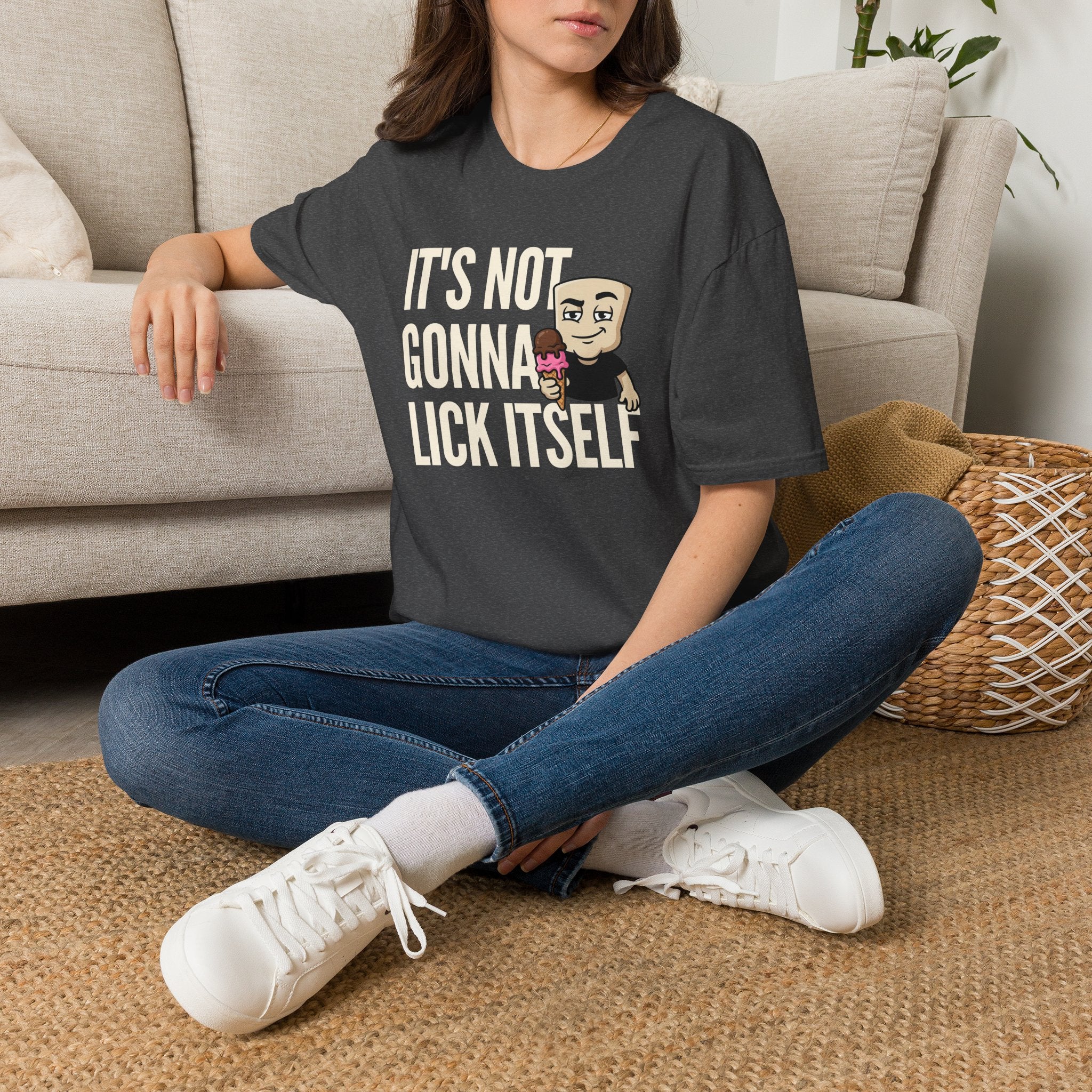Charcoal gray crewneck T-shirt with "IT'S NOT GONNA LICK ITSELF" graphic