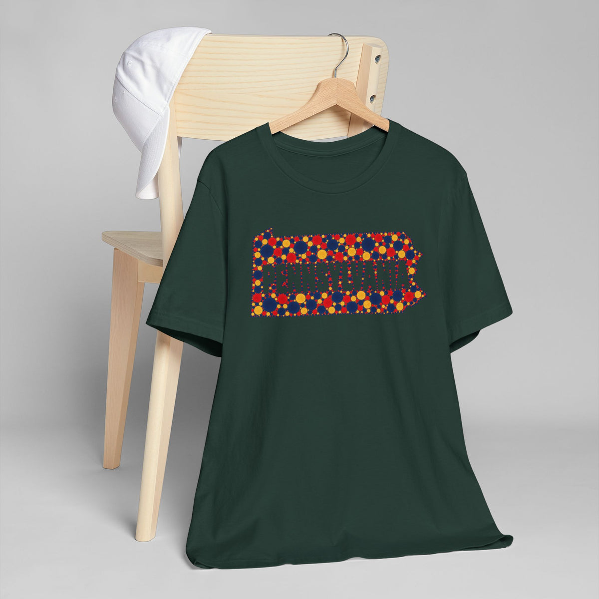 Forest green short-sleeve T-shirt with colorful floral Pennsylvania outline graphic