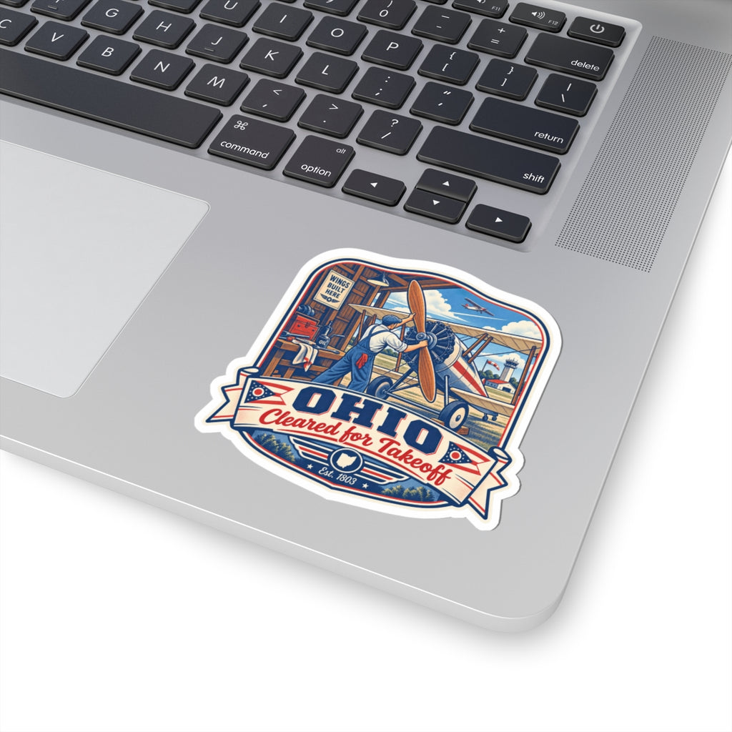Die-cut airplane decal with pilot and biplane, blue "OHIO" text, and "Cleared for Takeoff"
