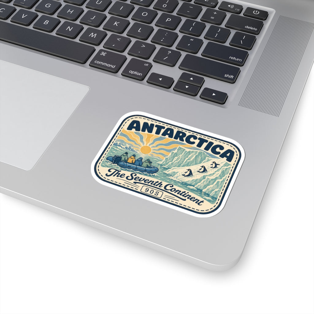 Antarctica travel badge sticker on a laptop surface, vintage “The Seventh Continent” design
