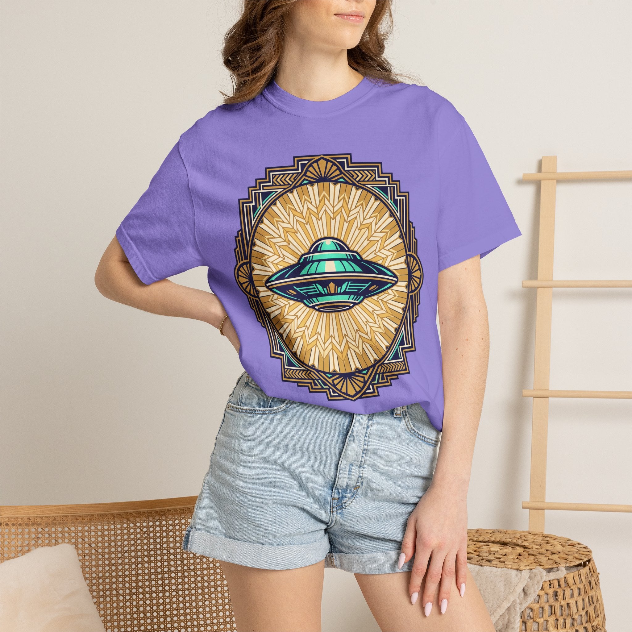 Purple UFO graphic T-shirt with teal flying saucer and sunburst emblem