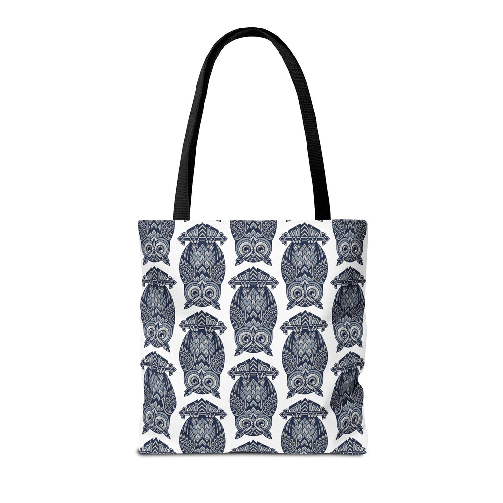 Cotton tote bag with repeating blue owl illustration pattern and black carrying handles.