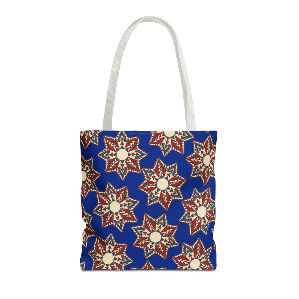 Blue tote bag with starburst floral pattern and white handles