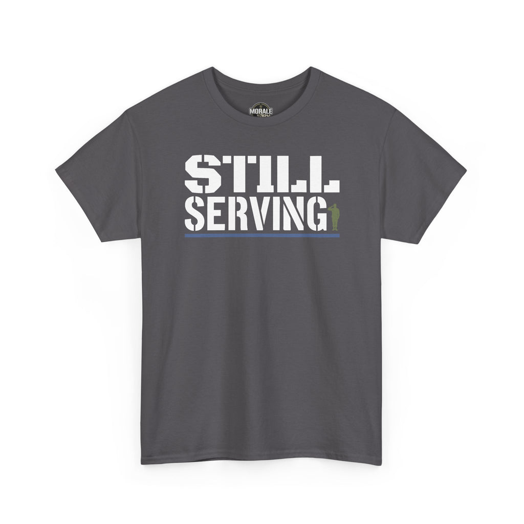 Charcoal T-shirt with 'STILL SERVING' distressed white text and green accent, crew neck.