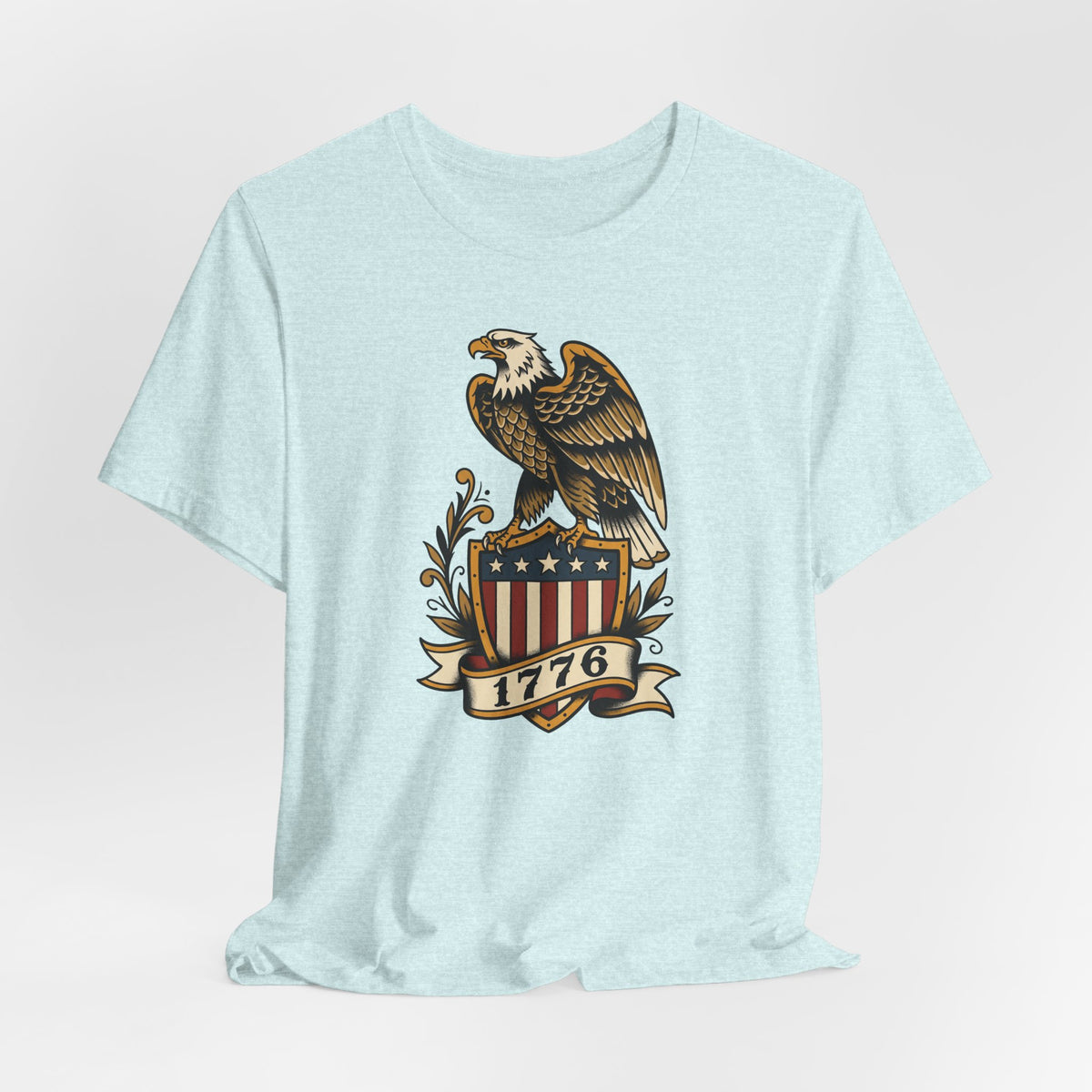 Light blue t-shirt with bald eagle standing on a shield graphic with stars and stripes