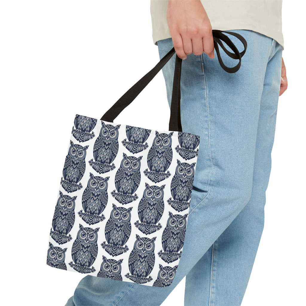 Owl pattern tote bag with dark handles, repeating blue and white owl illustrations.