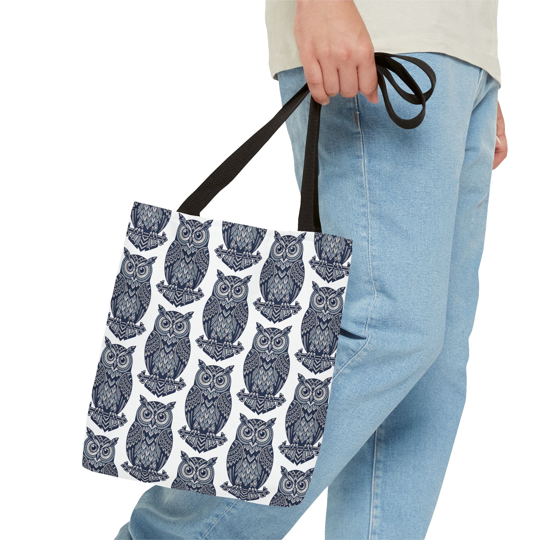 Owl pattern tote bag with dark handles, repeating blue and white owl illustrations.