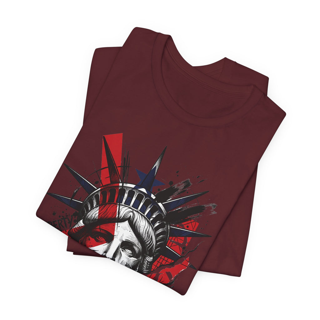 Maroon graphic t-shirt with Statue of Liberty face and crown splatter print