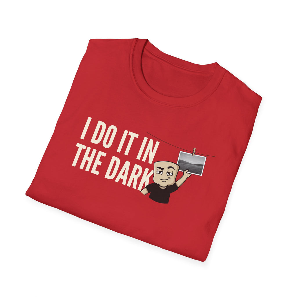 Red T-shirt with "I DO IT IN THE DARK" graphic and cartoon photographer