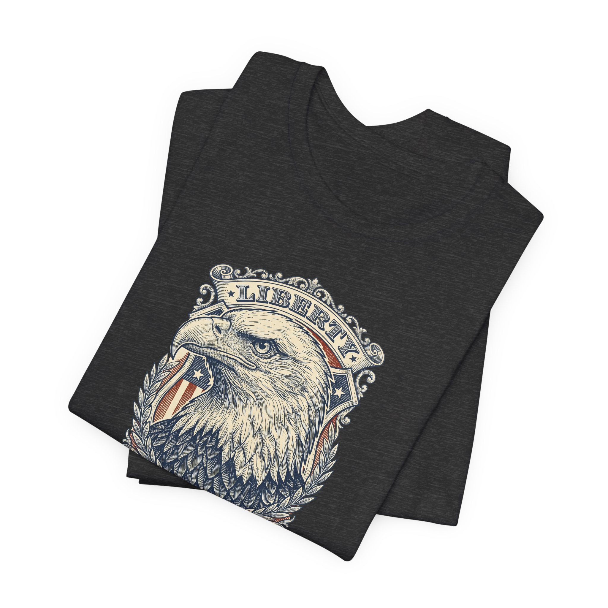 Dark heather crewneck t-shirt with eagle head graphic and laurel emblem on front.