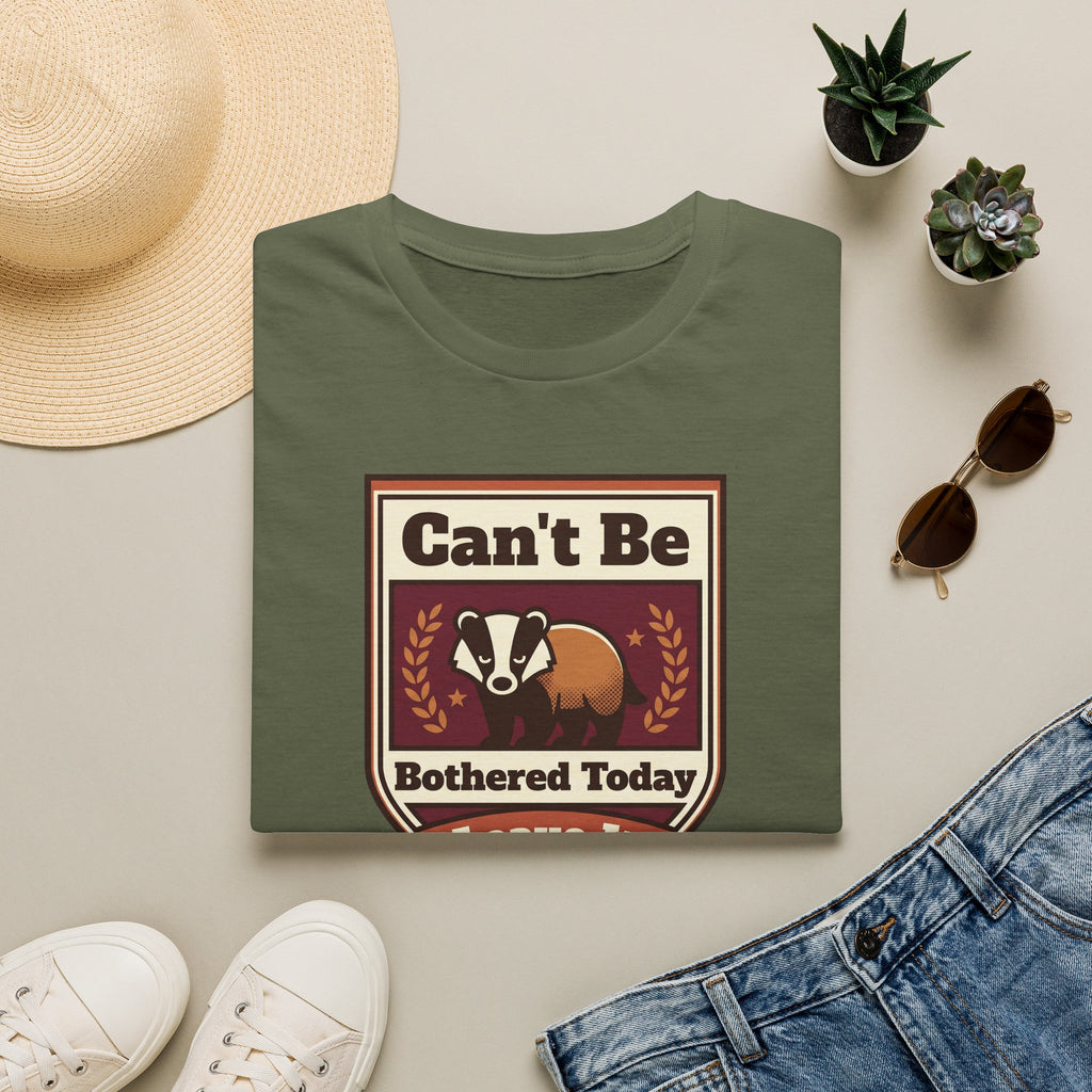 Military green crewneck t-shirt with badger badge graphic reading “Can’t Be Bothered Today”