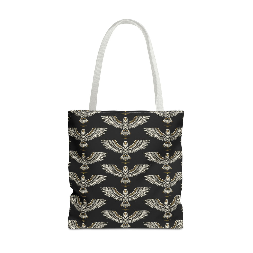Tote bag with winged scarab pattern on black fabric, gold emblems, cream top handles
