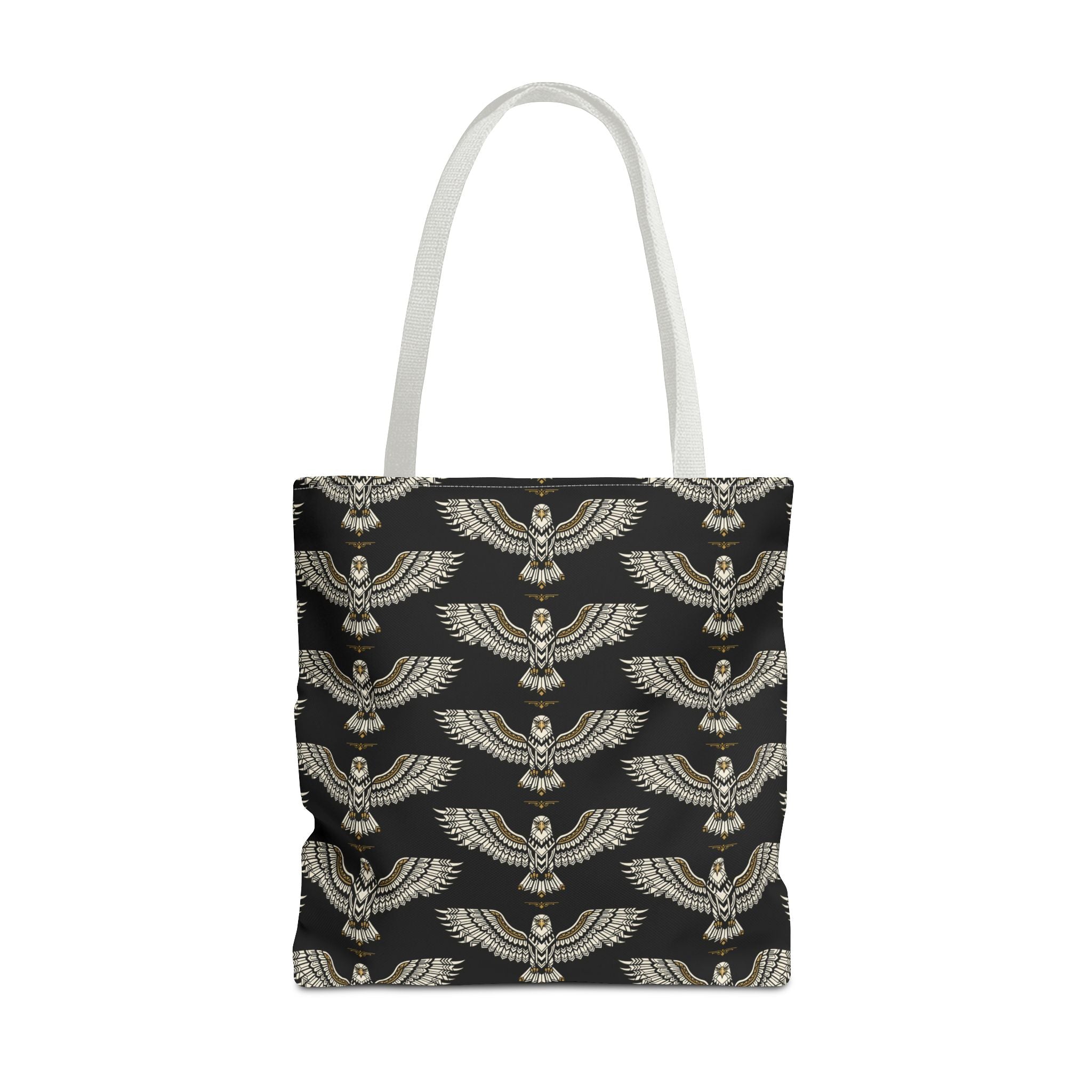 Tote bag with winged scarab pattern on black fabric, gold emblems, cream top handles
